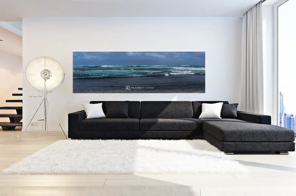 A panoramic RUDIBAT print hung above a sofa